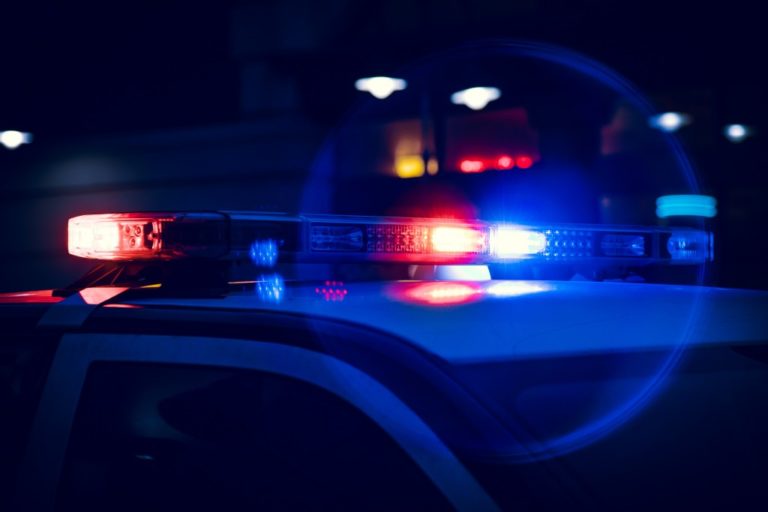 police car with lights at night