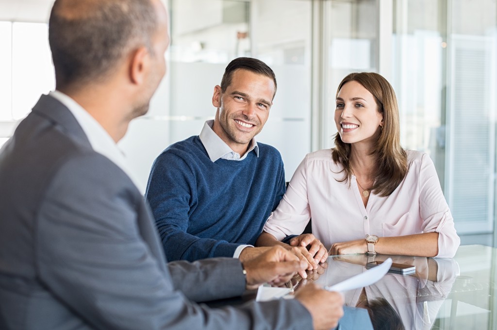 Couple talking to financial advisor