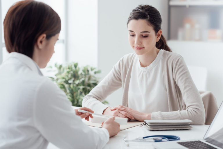 woman consulting a physician