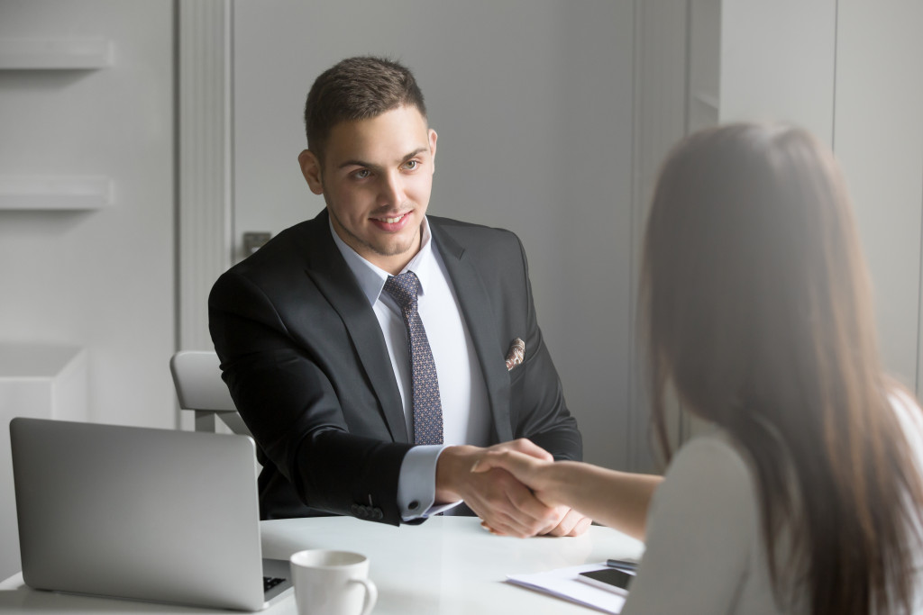 man shaking hands with client
