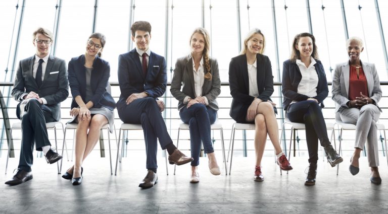 employees sitting next to each other