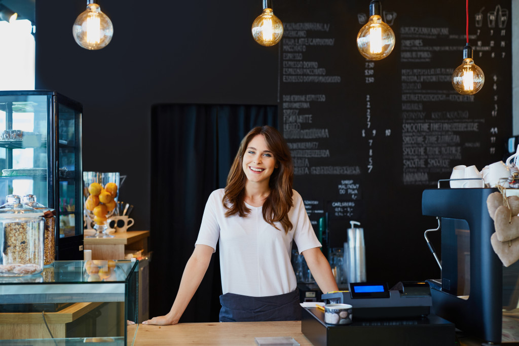 woman behind counter of cafe