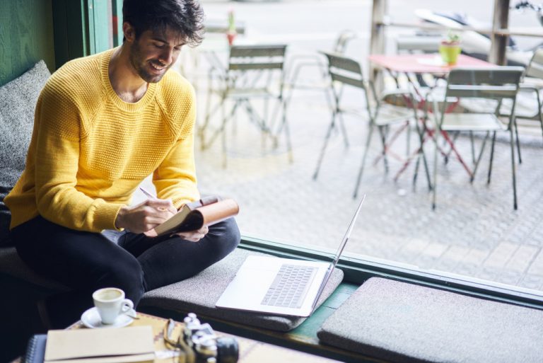man taking notes