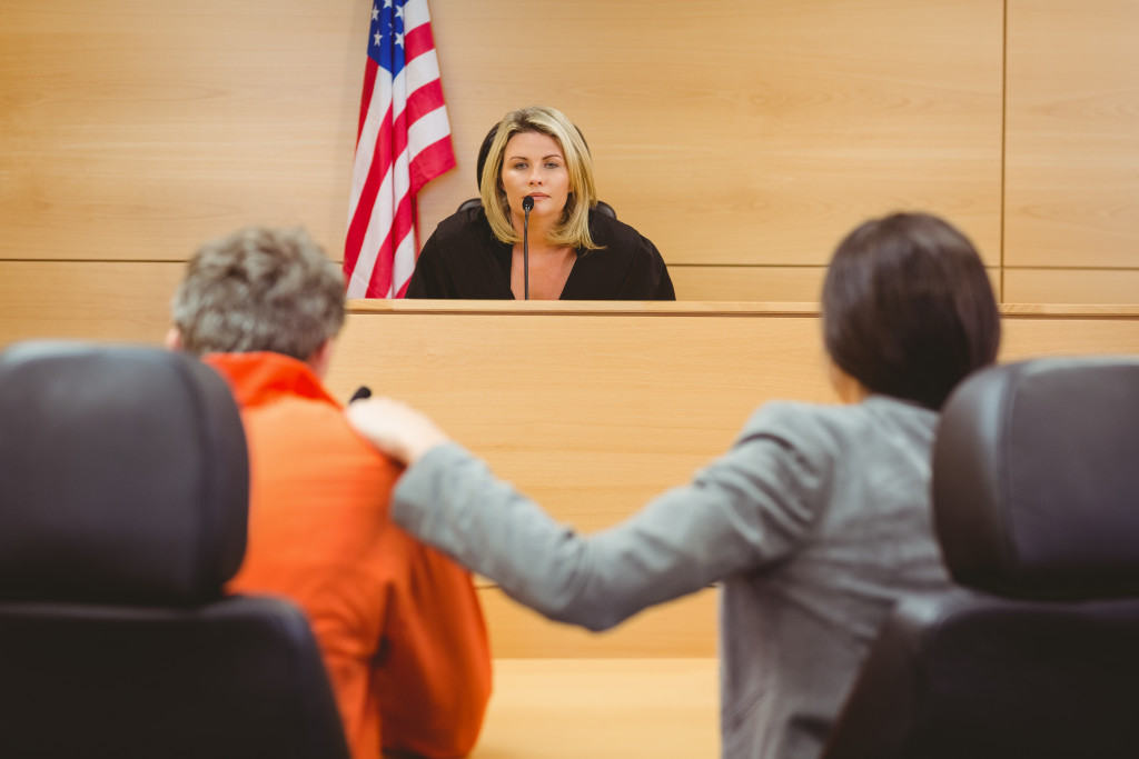 two people in front of a judge