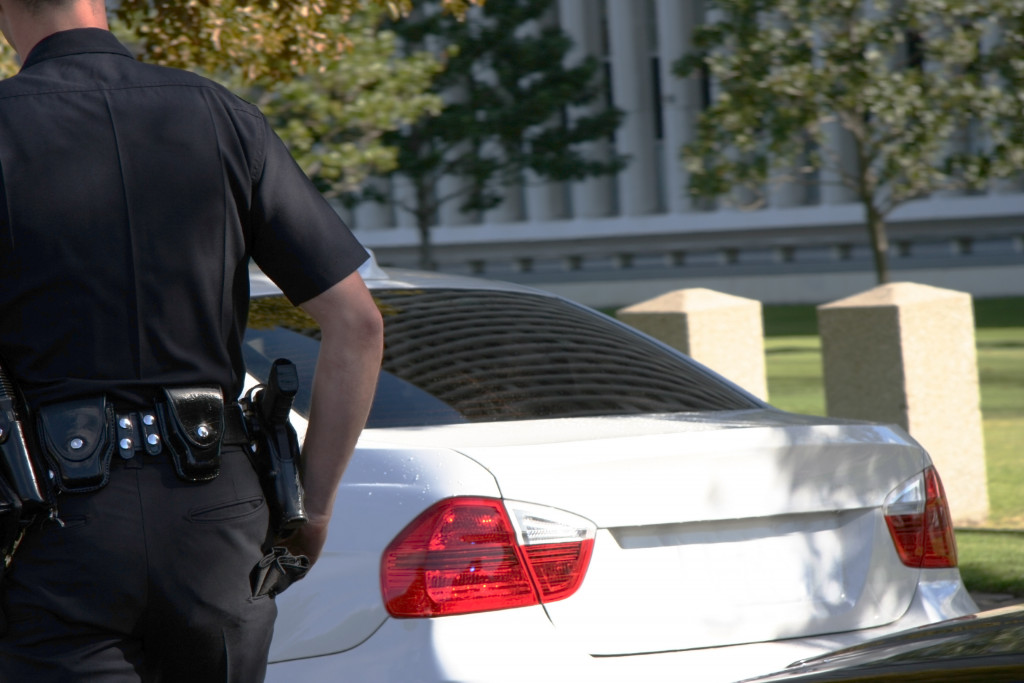 police approaching a vehicle