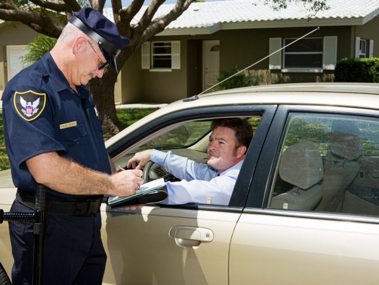 officer writing a driving ticket