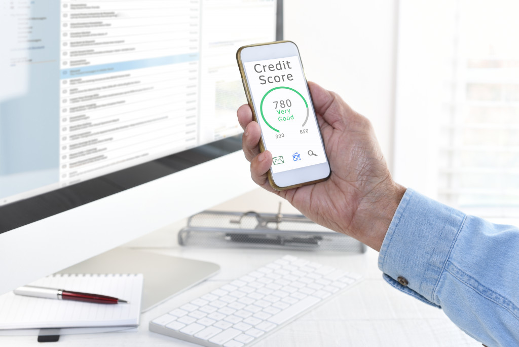 man checking credit score on smartphone