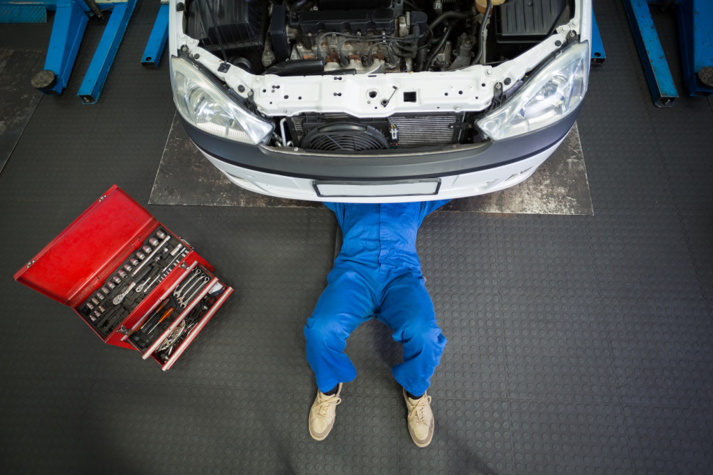 a car repairman doing repair work