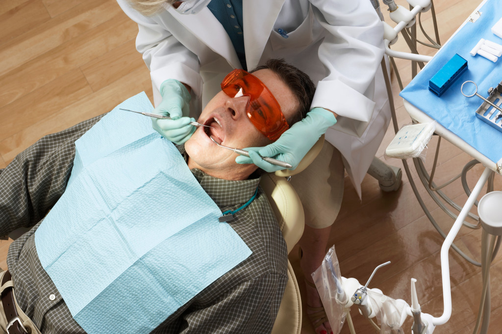 businessman having a dental check up