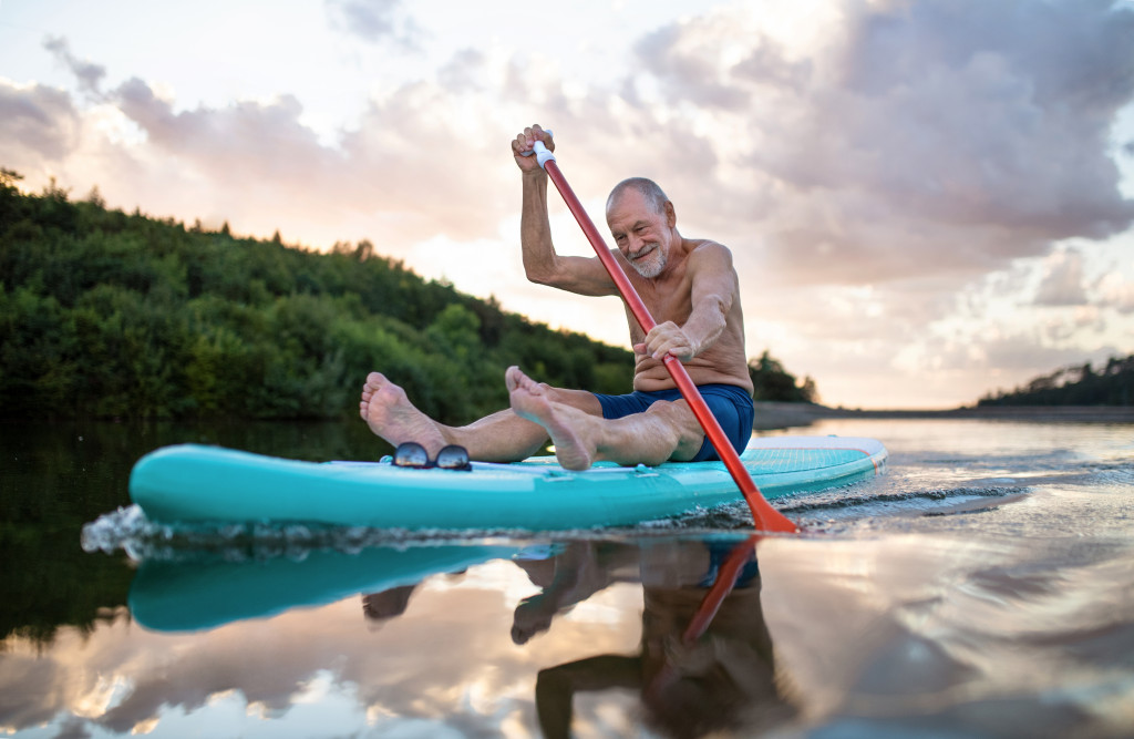 A man trying out paddleboarding as a hobby