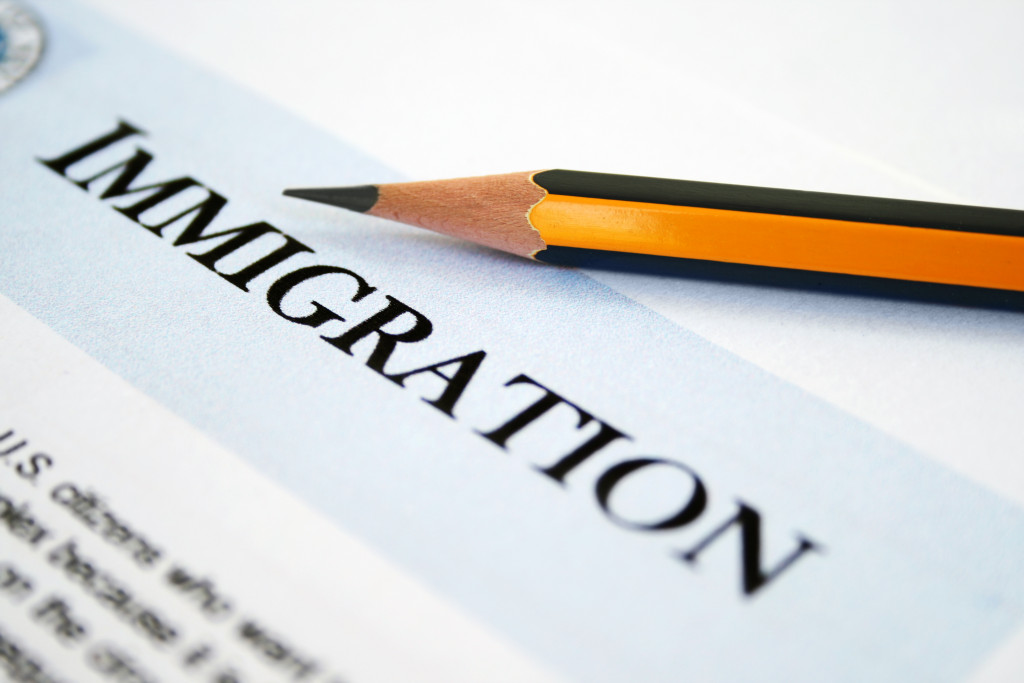 immigration document with a pencil on top