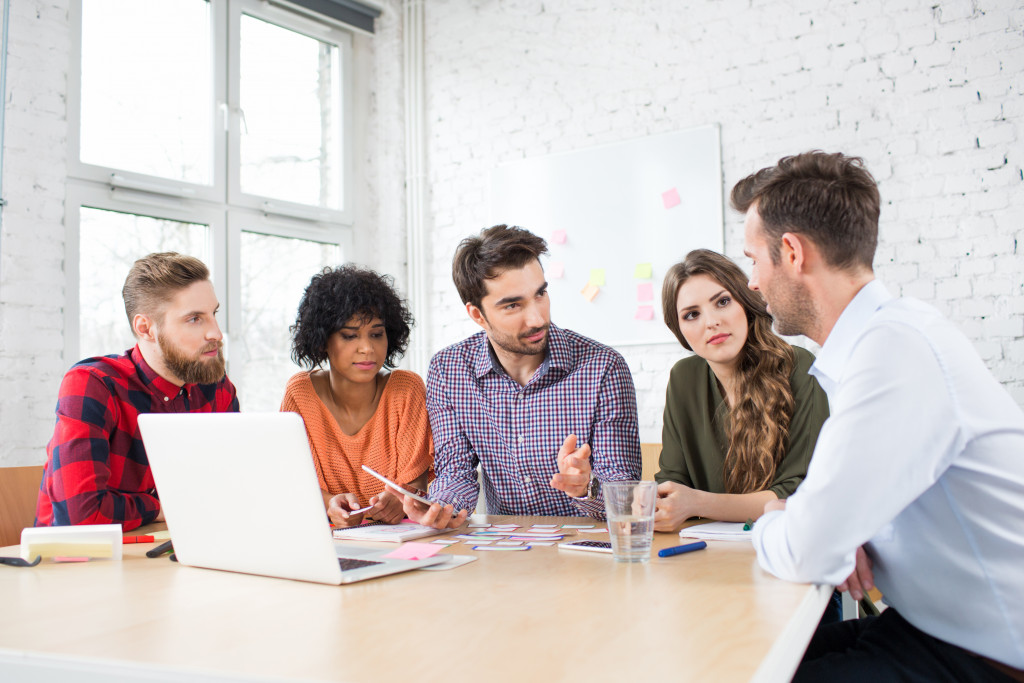 A group of professionals collaborating on a project in an office space