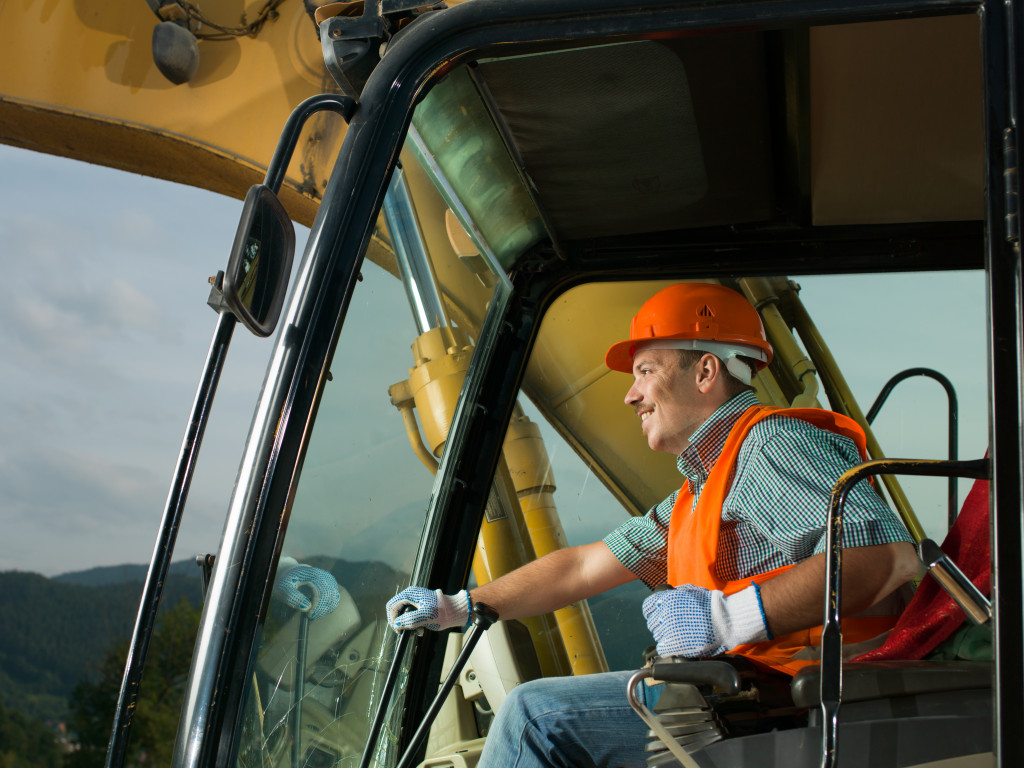 smiling operator of heavy equipment