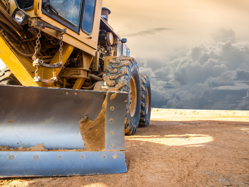 a truck in action , muddy site 