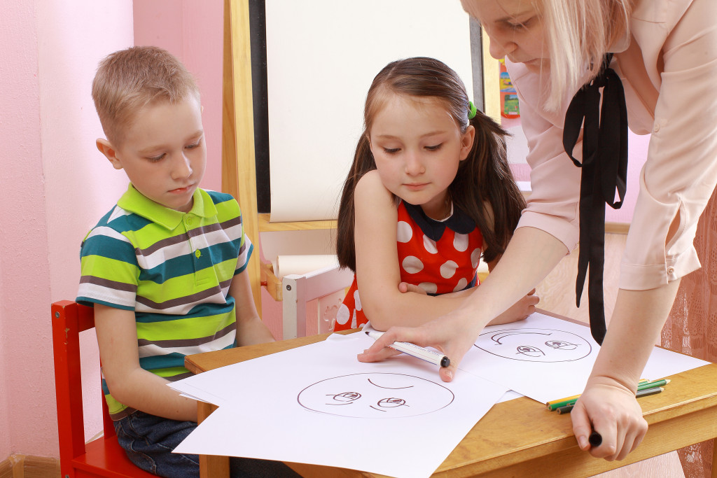 child psychology. girl and boy depict different emotions.