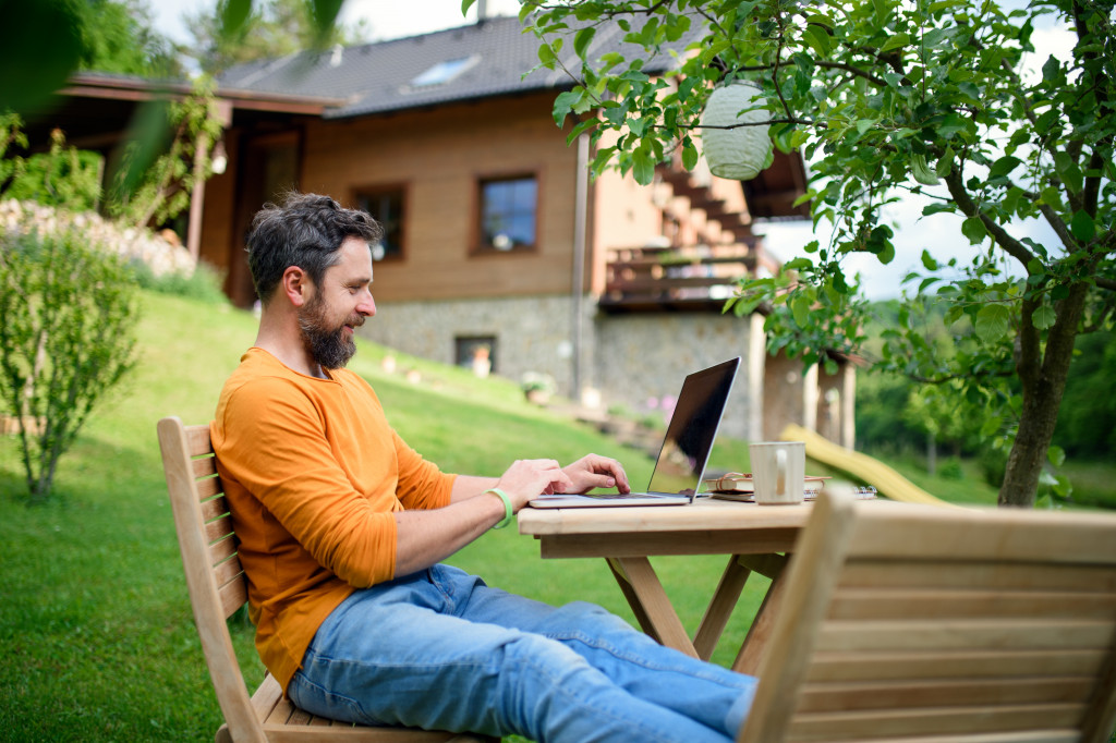 Man working outdoors in a garden.