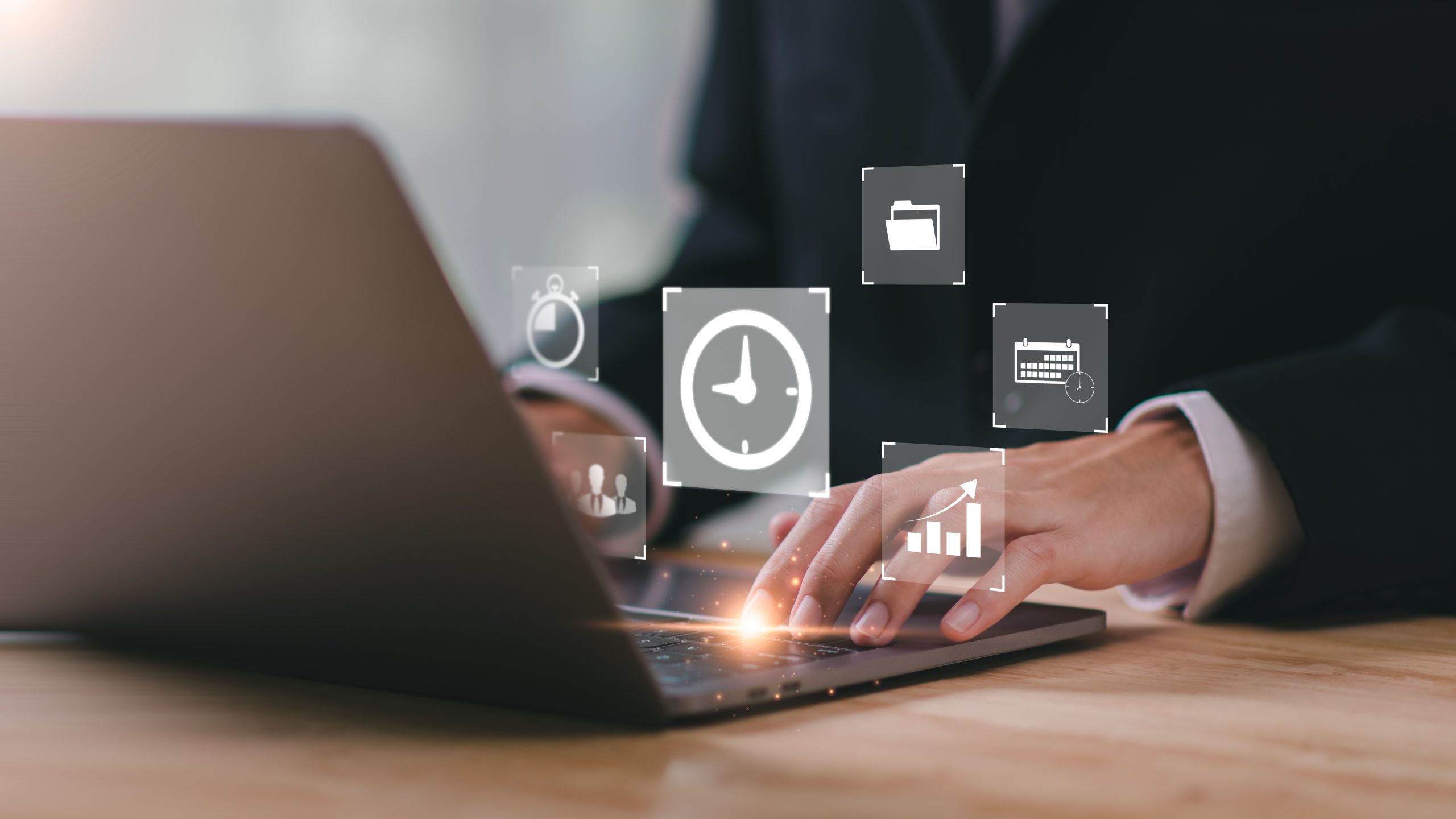 man in a suit using a laptop